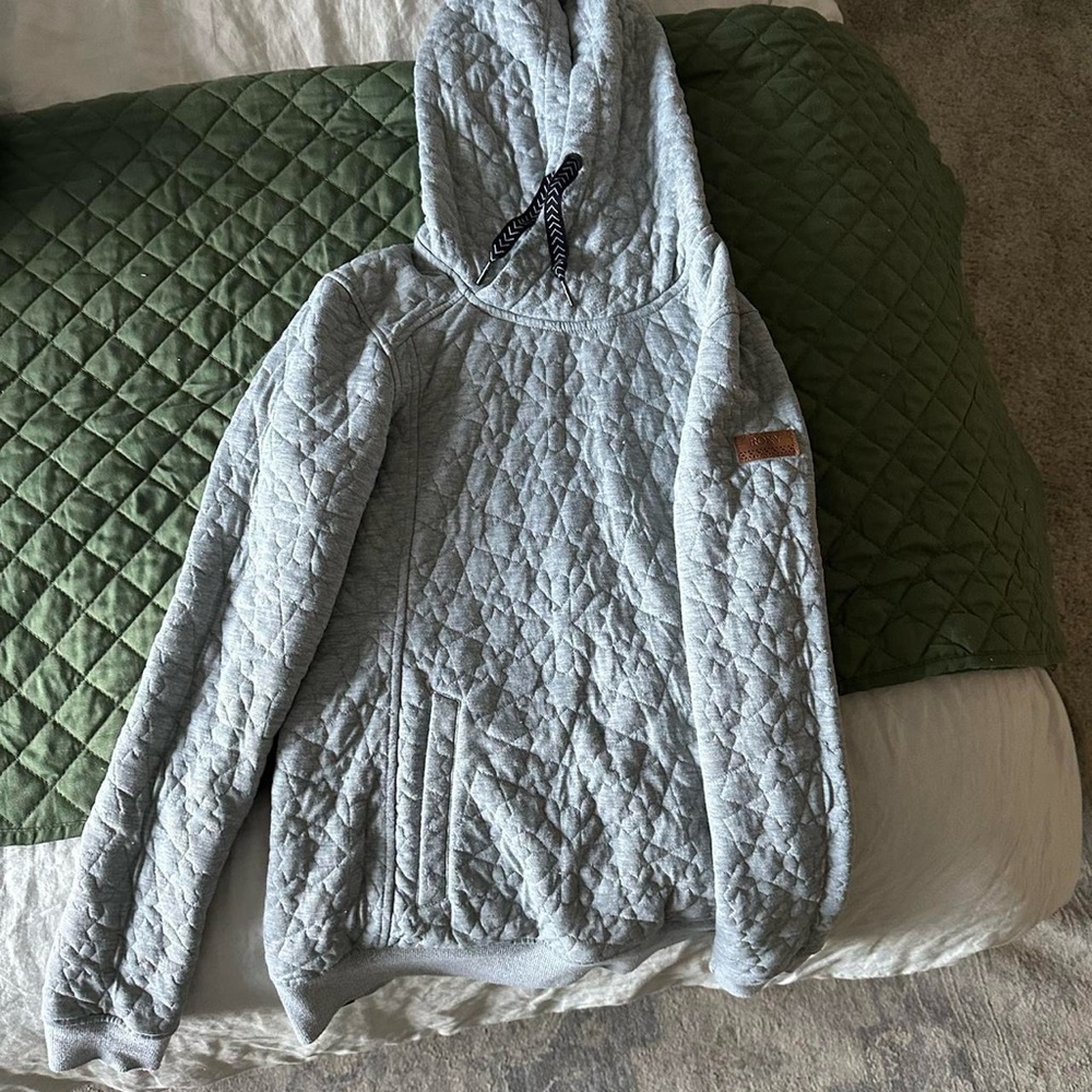 Roxy light grey "Aspen Snowmass" embroidered on the sleeve as pictured